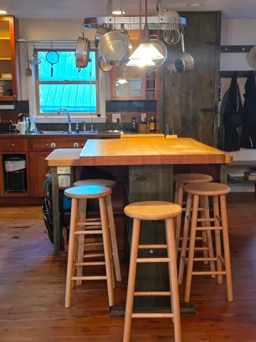 a room with furniture and wooden floor