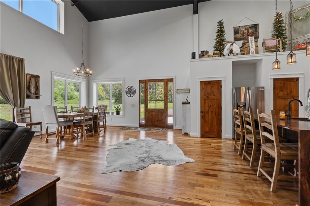 1590 4 Mile Church Road Ball Ground, GA 30107 - Photo 20 of 65 a view of a dining room with furniture window and wooden floor