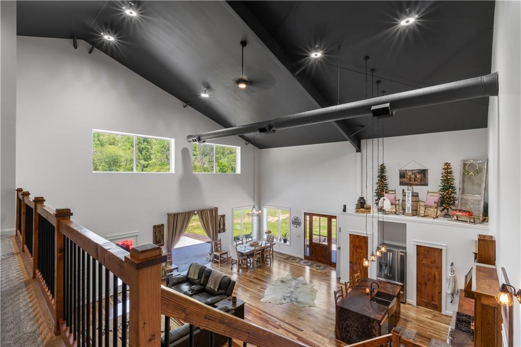 1590 4 Mile Church Road Ball Ground, GA 30107 - Photo 23 of 65 a very nice looking room with a dining table chairs with wooden floor