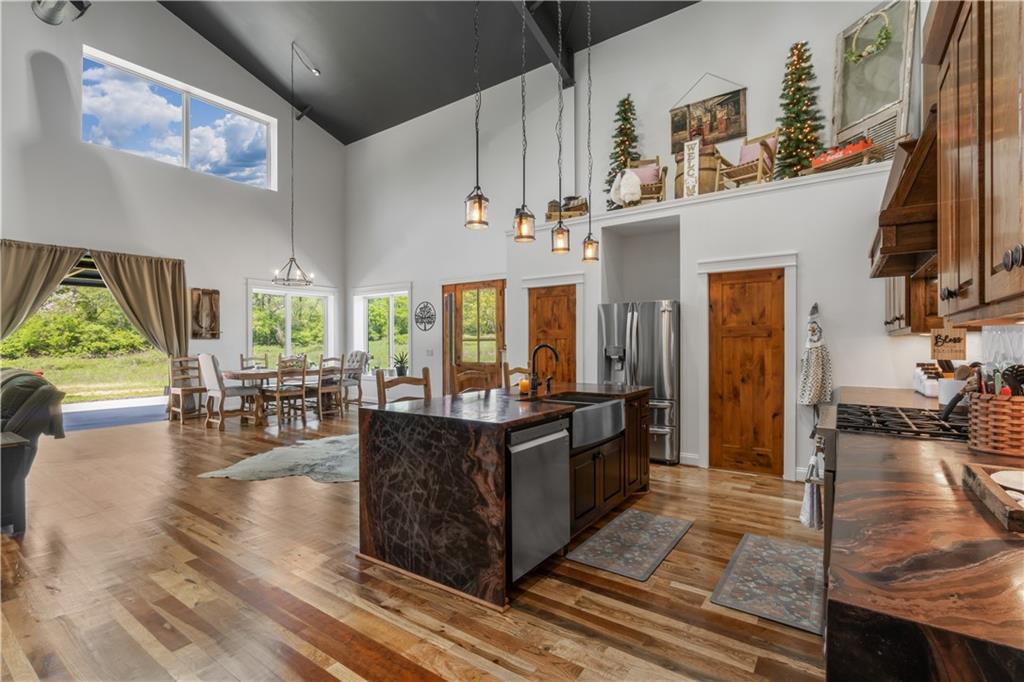 1590 4 Mile Church Road Ball Ground, GA 30107 - Photo 24 of 65 a living room with furniture and a large window