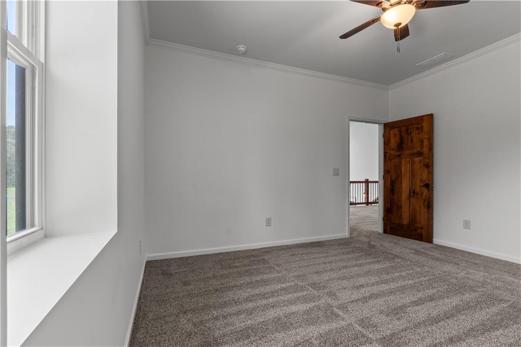1590 4 Mile Church Road Ball Ground, GA 30107 - Photo 47 of 65 a view of an empty room with a window
