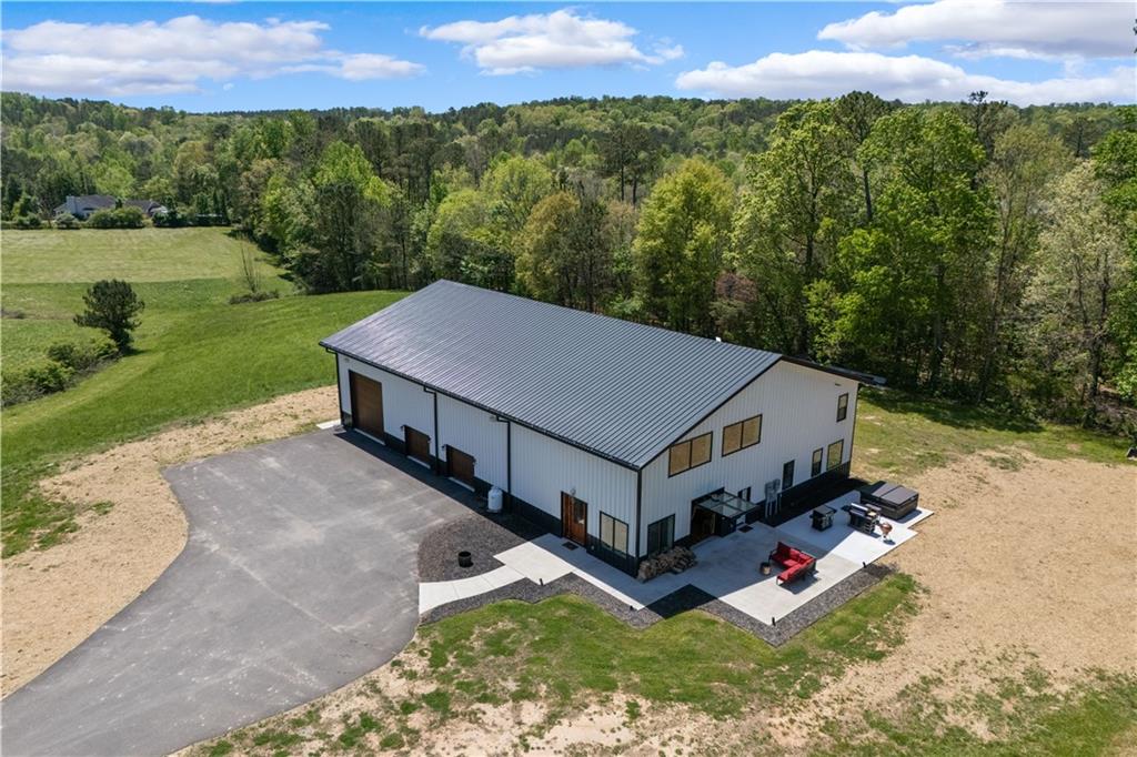 1590 4 Mile Church Road Ball Ground, GA 30107 - Photo 9 of 65 an aerial view of a house