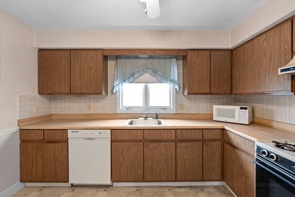 70 North Court Street, Unit F Fall River, MA 02720 - Photo 7 of 20 a kitchen with a sink cabinets and window