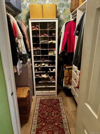 a bedroom with a bed and a mirror