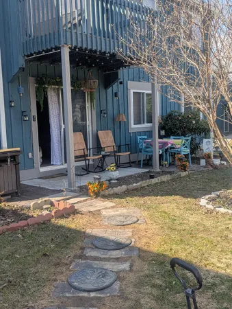 a view of a house with backyard water and sitting area