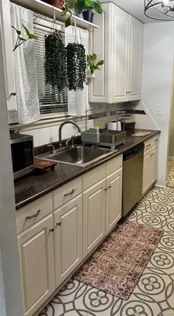 a kitchen with a stove and a refrigerator