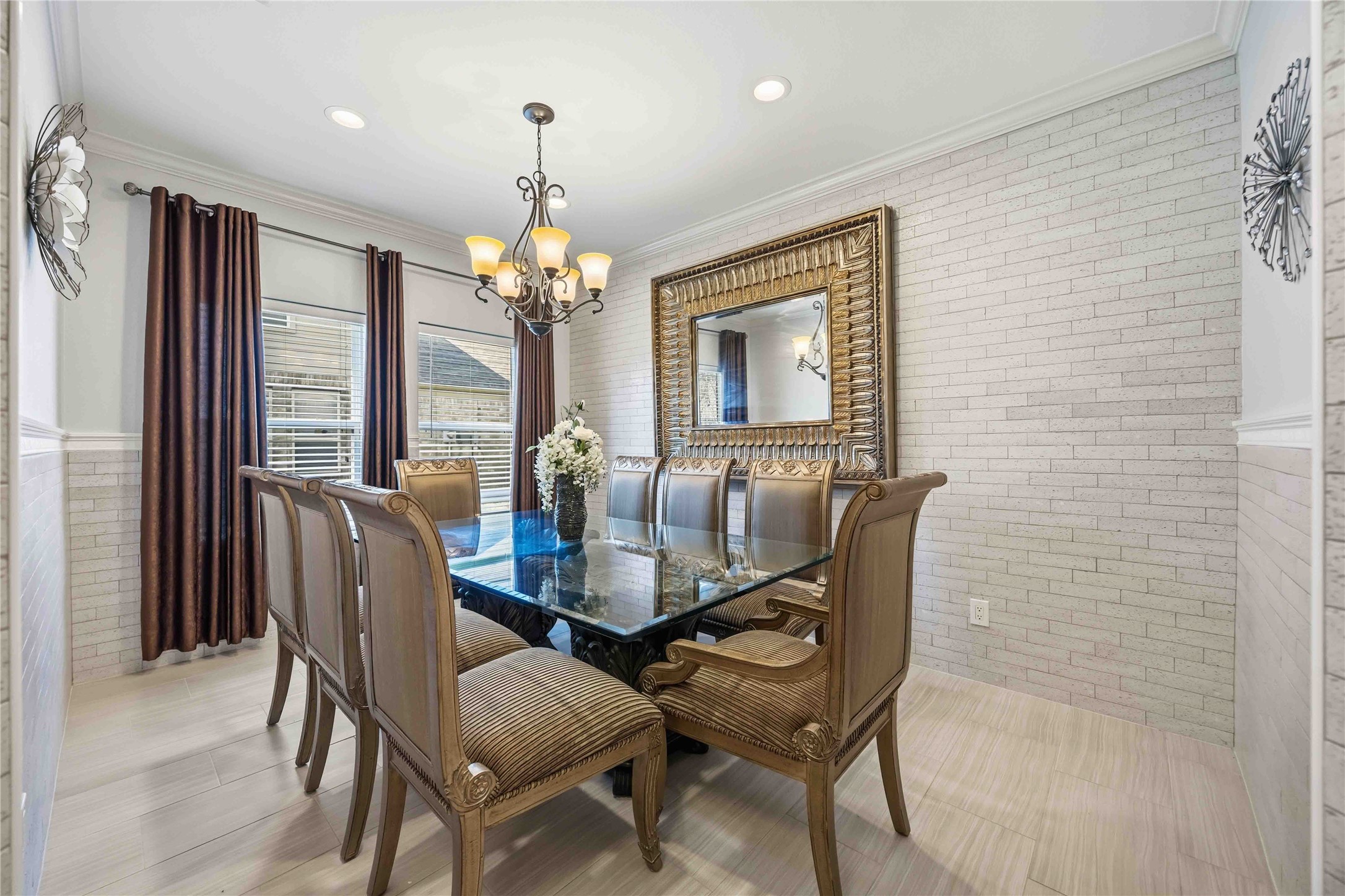 19219 Brook Village Road Houston, TX 77084 - Photo 11 of 29 a dining room with furniture a chandelier and window