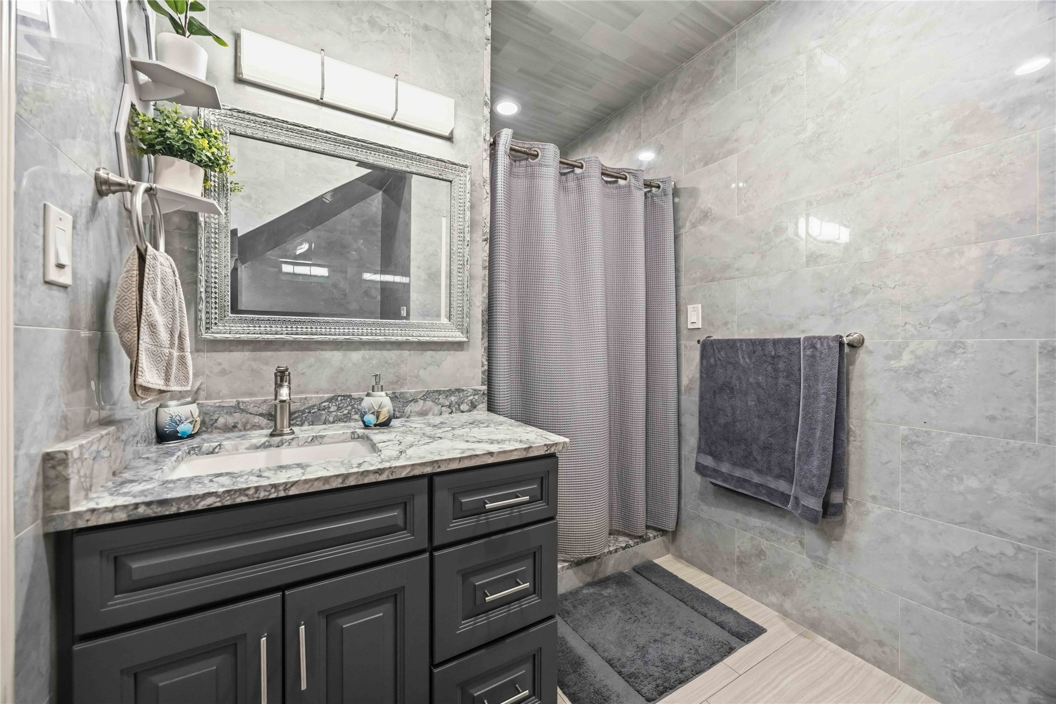 19219 Brook Village Road Houston, TX 77084 - Photo 15 of 29 a bathroom with a granite countertop sink vanity and mirror