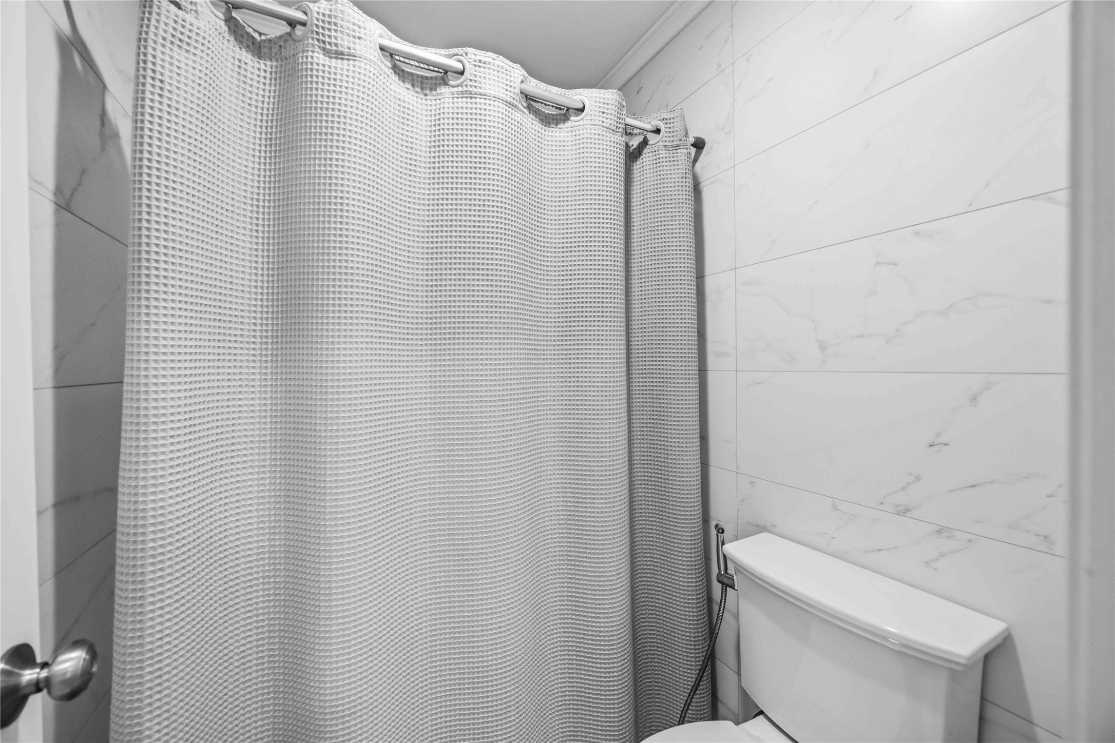 19219 Brook Village Road Houston, TX 77084 - Photo 17 of 29 a bathroom with a shower curtain