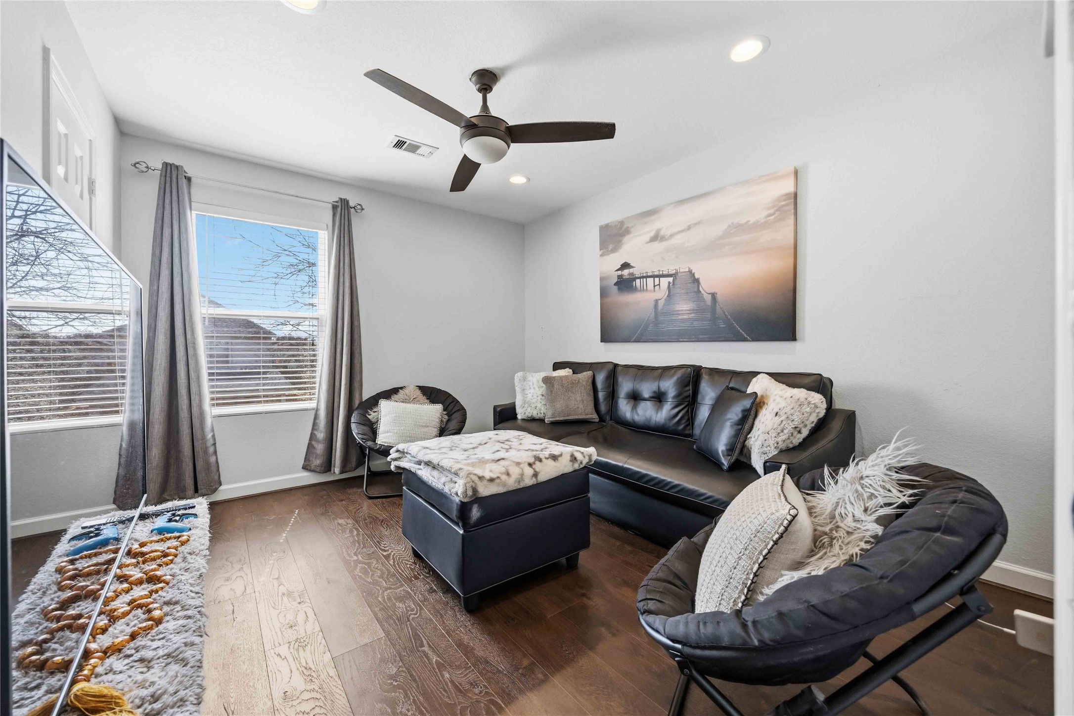 19219 Brook Village Road Houston, TX 77084 - Photo 18 of 29 a living room with furniture and a large window