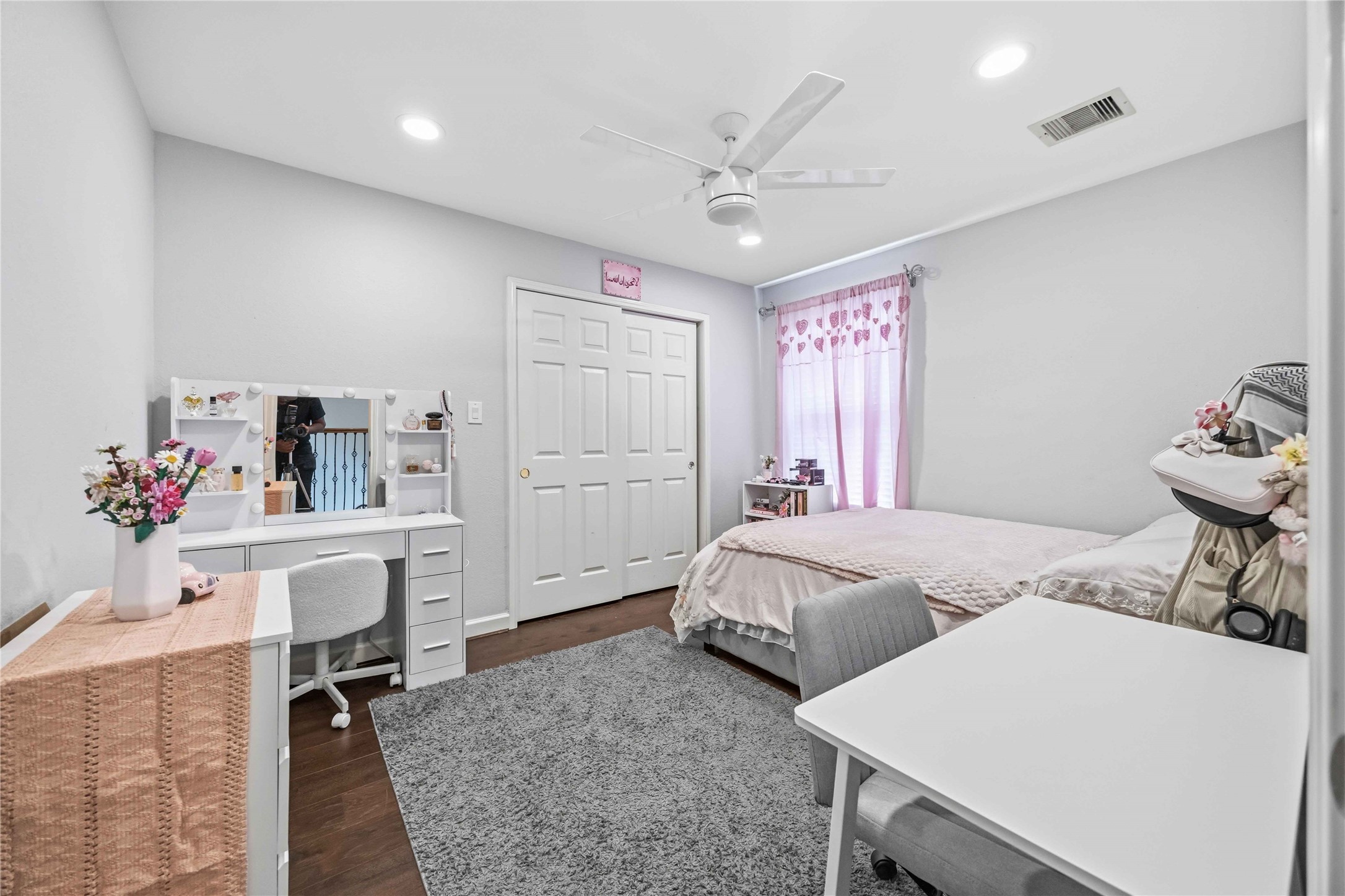 19219 Brook Village Road Houston, TX 77084 - Photo 20 of 29 a spacious bedroom with two beds and a desk