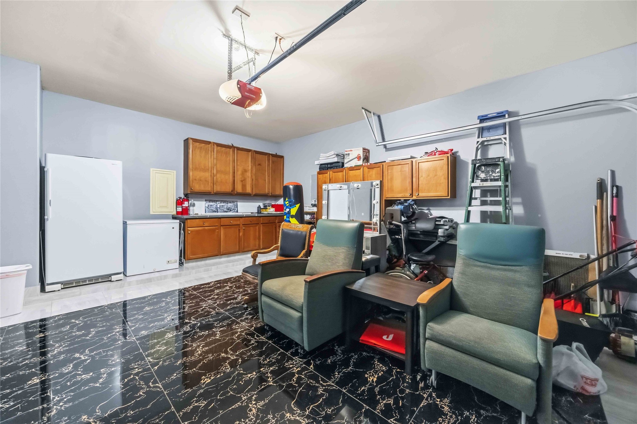 19219 Brook Village Road Houston, TX 77084 - Photo 27 of 29 a living room with furniture and a flat screen tv