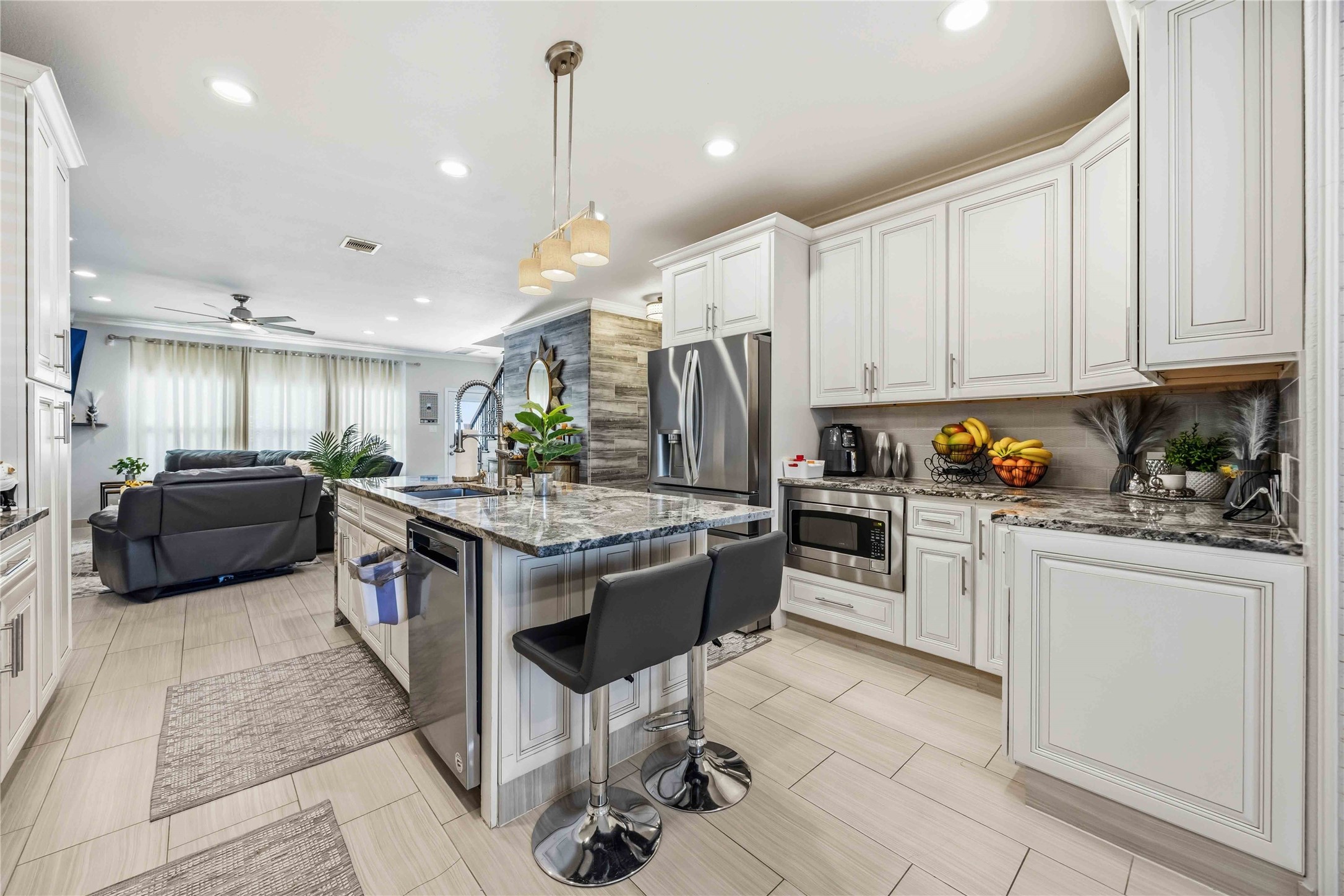 19219 Brook Village Road Houston, TX 77084 - Photo 4 of 29 a kitchen with a sink stove and cabinets