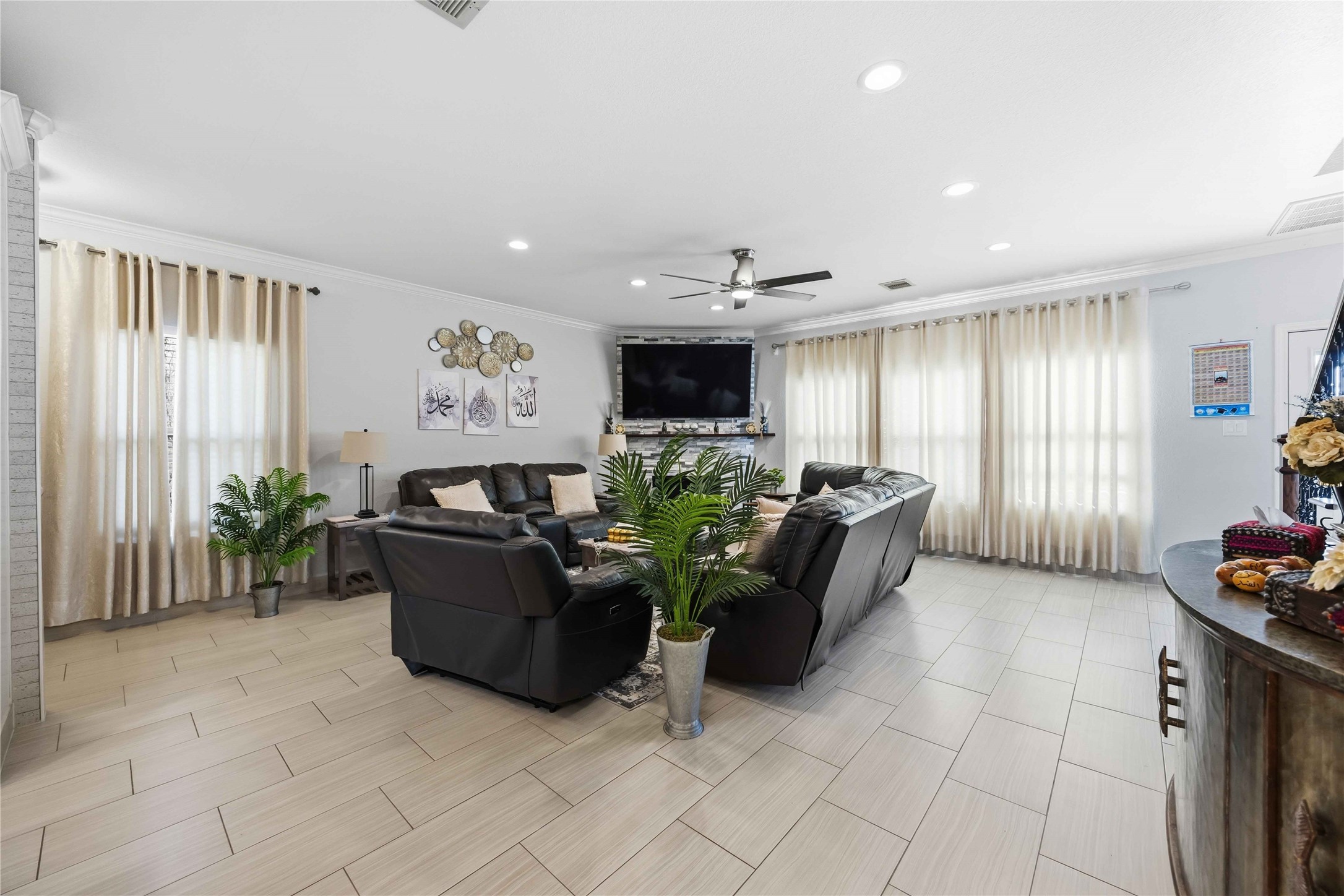 19219 Brook Village Road Houston, TX 77084 - Photo 8 of 29 a living room with furniture and a flat screen tv