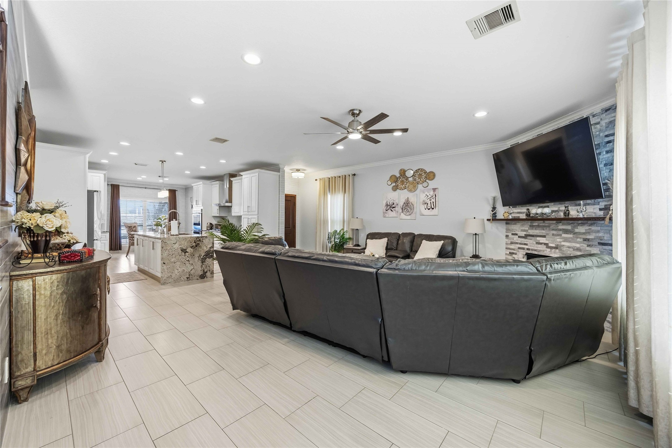 19219 Brook Village Road Houston, TX 77084 - Photo 9 of 29 a living room with furniture and a flat screen tv