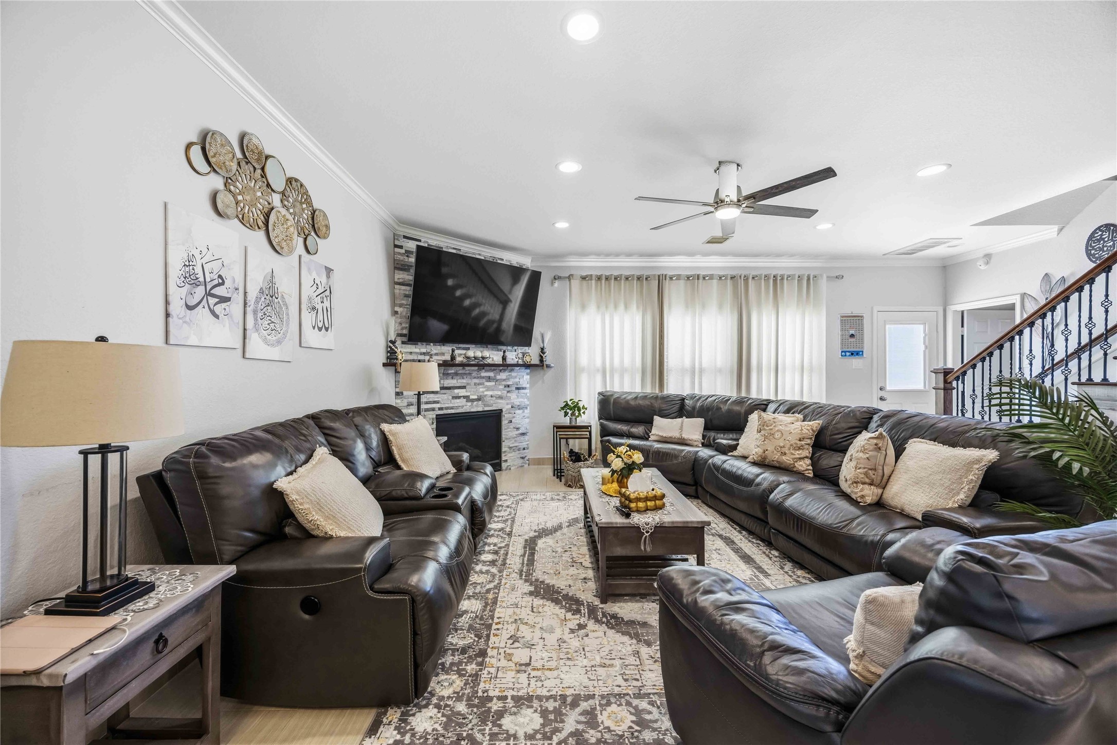 19219 Brook Village Road Houston, TX 77084 - Photo 10 of 29 a living room with furniture and a flat screen tv