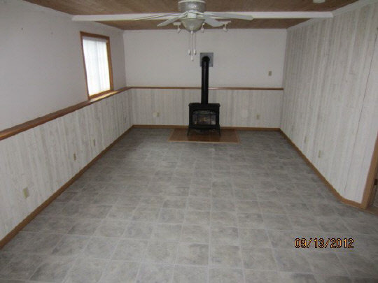 12951 Holverson Road Durand, IL 61024 - Photo 9 of 11 a view of a livingroom with a ceiling fan