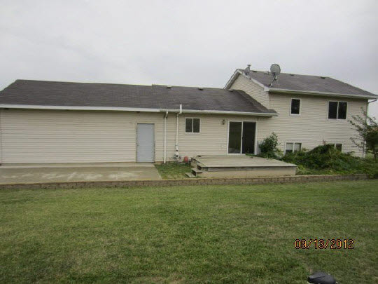 12951 Holverson Road Durand, IL 61024 - Photo 10 of 11 a house view with a backyard space