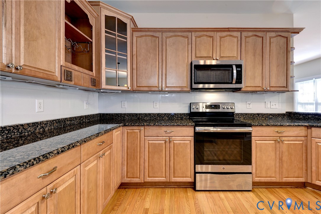11385 Winding River Road Providence Forge, VA 23140 - Photo 16 of 43 a kitchen with stainless steel appliances granite countertop a stove and a microwave