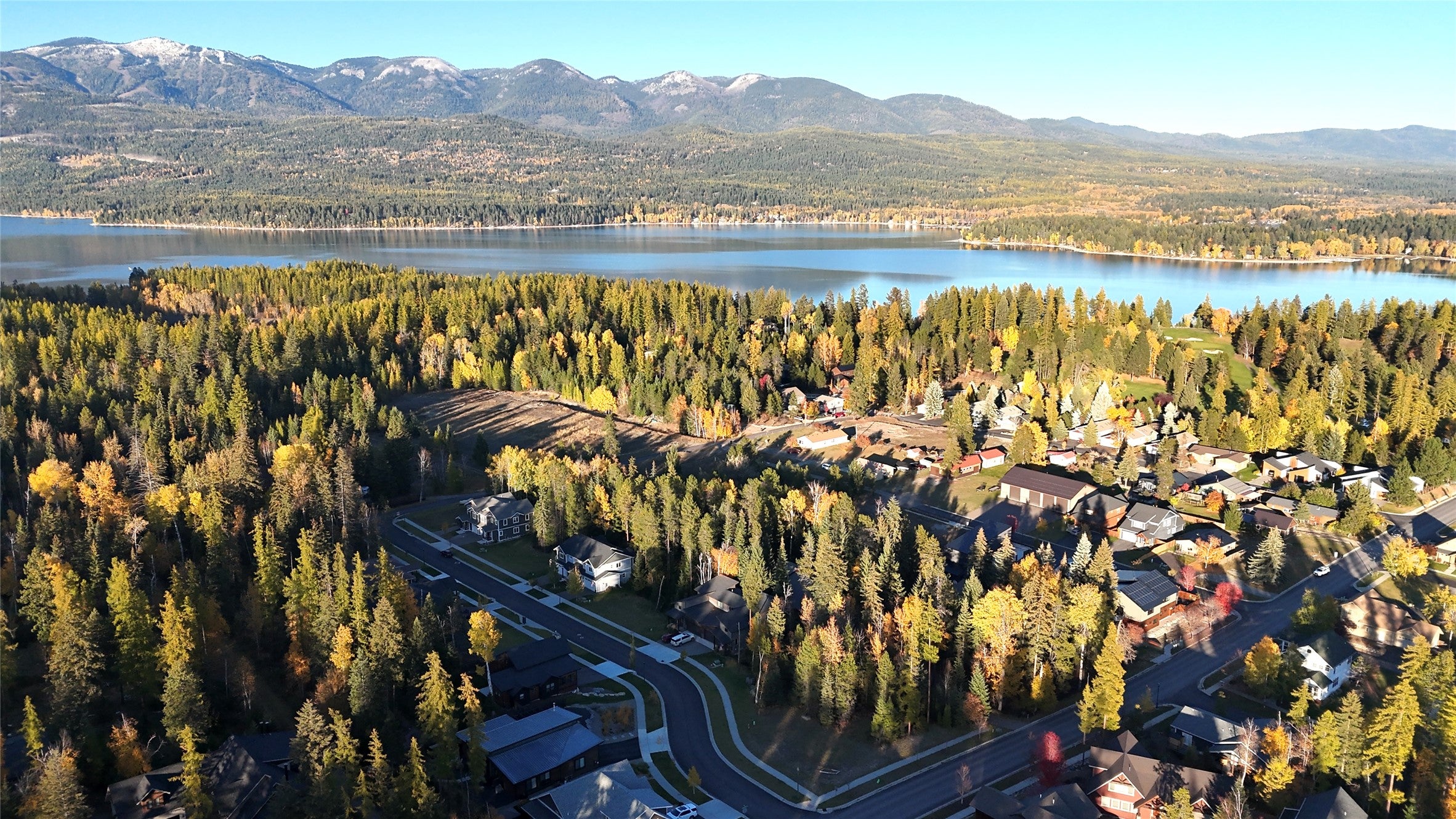 717 Icehouse Road Whitefish, MT 59937 - Photo 26 of 31 Aerial view of property's location with a forest and a water and mountain view