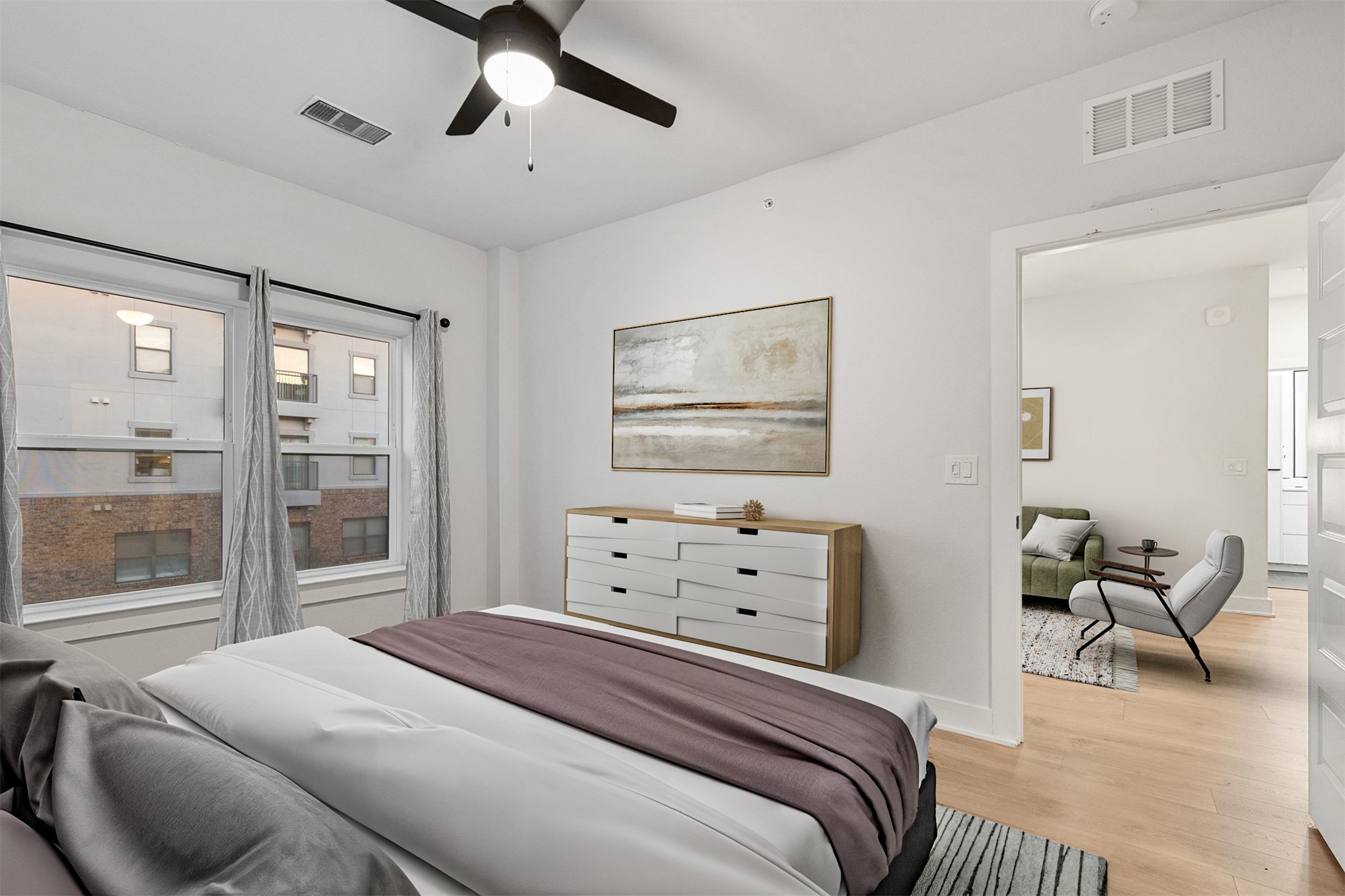 2500 Longview Street, Unit 418 Austin, TX 78705 - Photo 14 of 40 Bedroom with light wood-style flooring and a ceiling fan