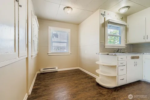 a room with cabinets and wooden floor