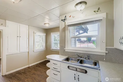a bathroom with a sink and a window