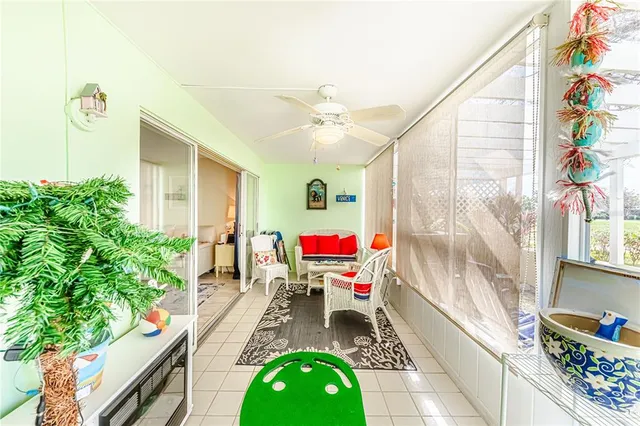 a room with potted plants and a chandelier