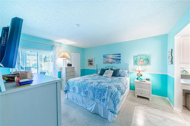 a bedroom with a bed and a table