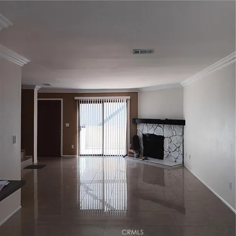wooden floor fireplace and windows in a room