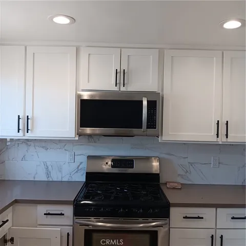 a bathroom with a sink and a window