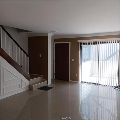 a view of an empty room with stairs