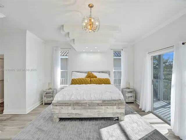 a bedroom with a bed and a mirror