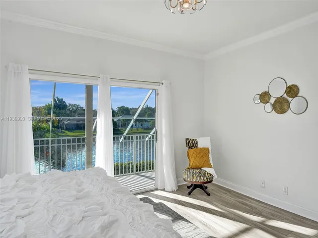 a bathroom with a shower curtain and a window