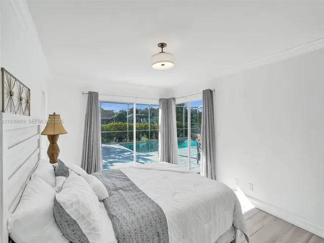 a bathroom with a double vanity sink a toilet and shower
