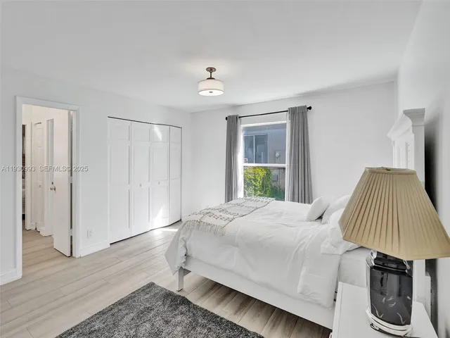 a view of a garden with a house