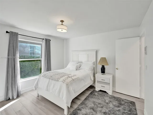 a view of a lake with houses in the back