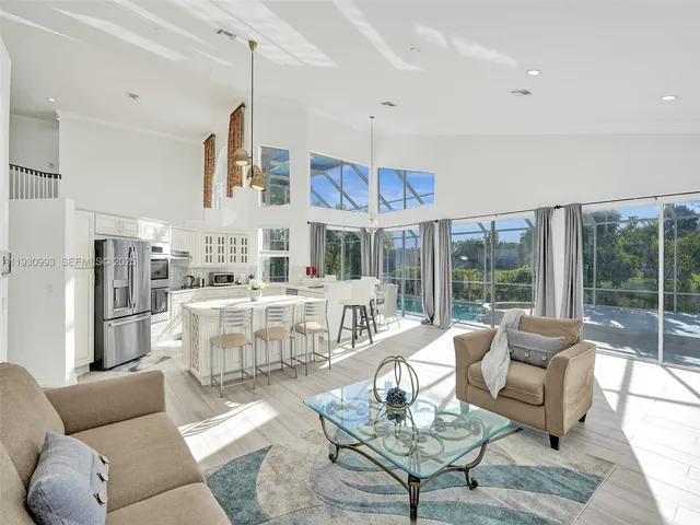 a outdoor space with the couches and dining table chair with the outer view