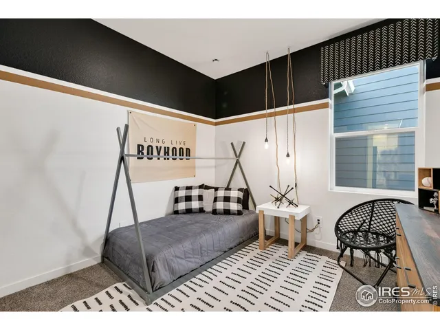 a bedroom with furniture and window