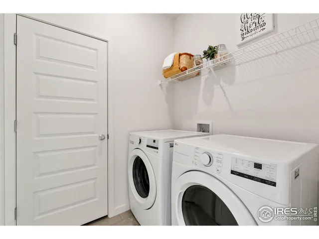 a view of storage and utility room with washer and dryer