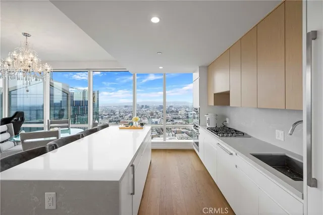 a large white kitchen with a large window