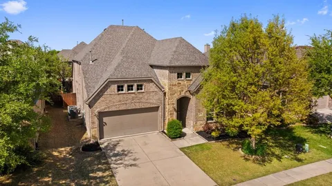 a aerial view of a house with a yard