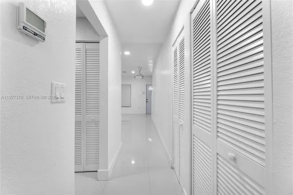 a view of a bathroom from a hallway