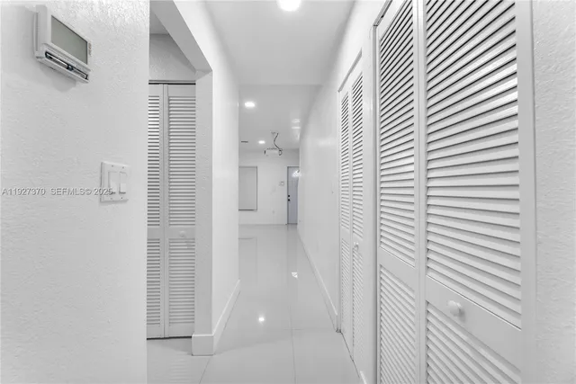 a view of a bathroom from a hallway