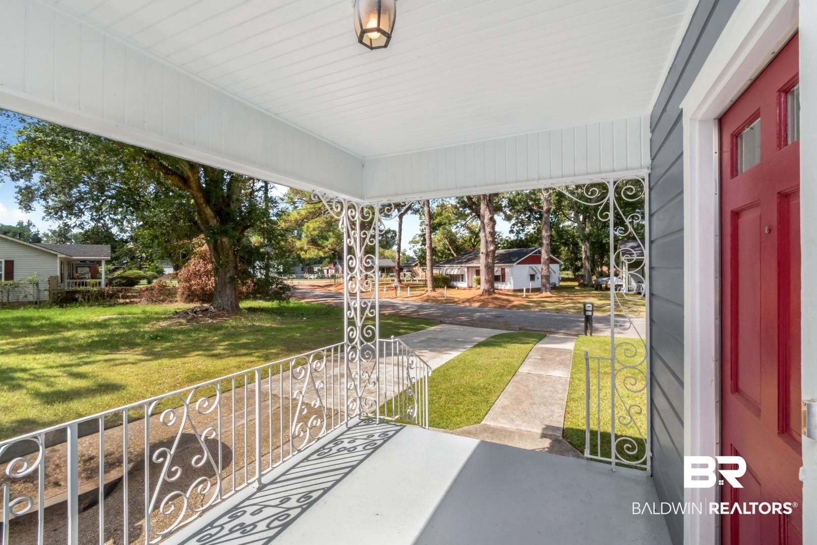 1477 Fairfield Street Mobile, AL 36606 - Photo 7 of 34 Covered porch featuring a lawn