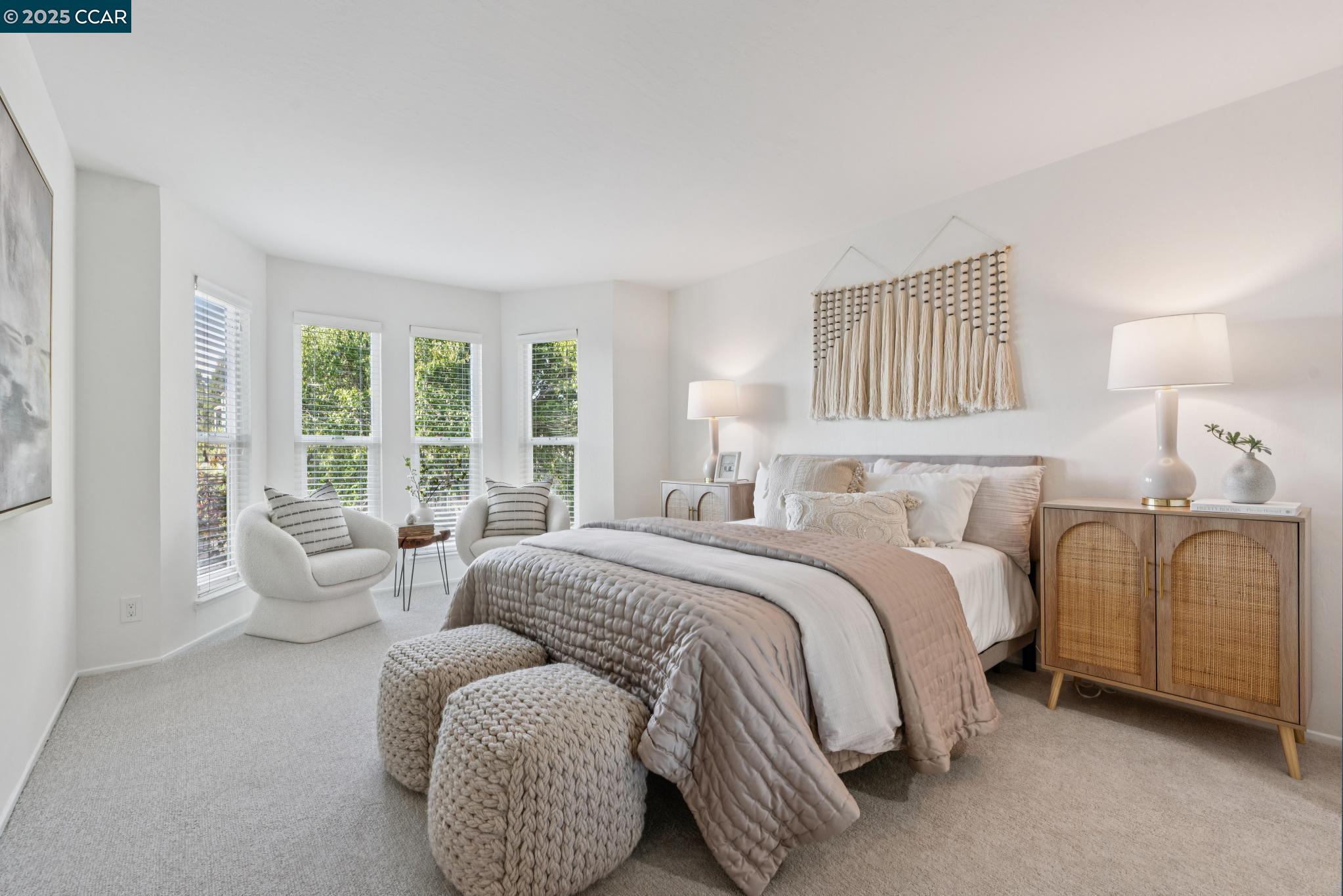 500 Vernon Street, Unit 102 Oakland, CA 94610 - Photo 17 of 43 a spacious bedroom with a bed and a couch