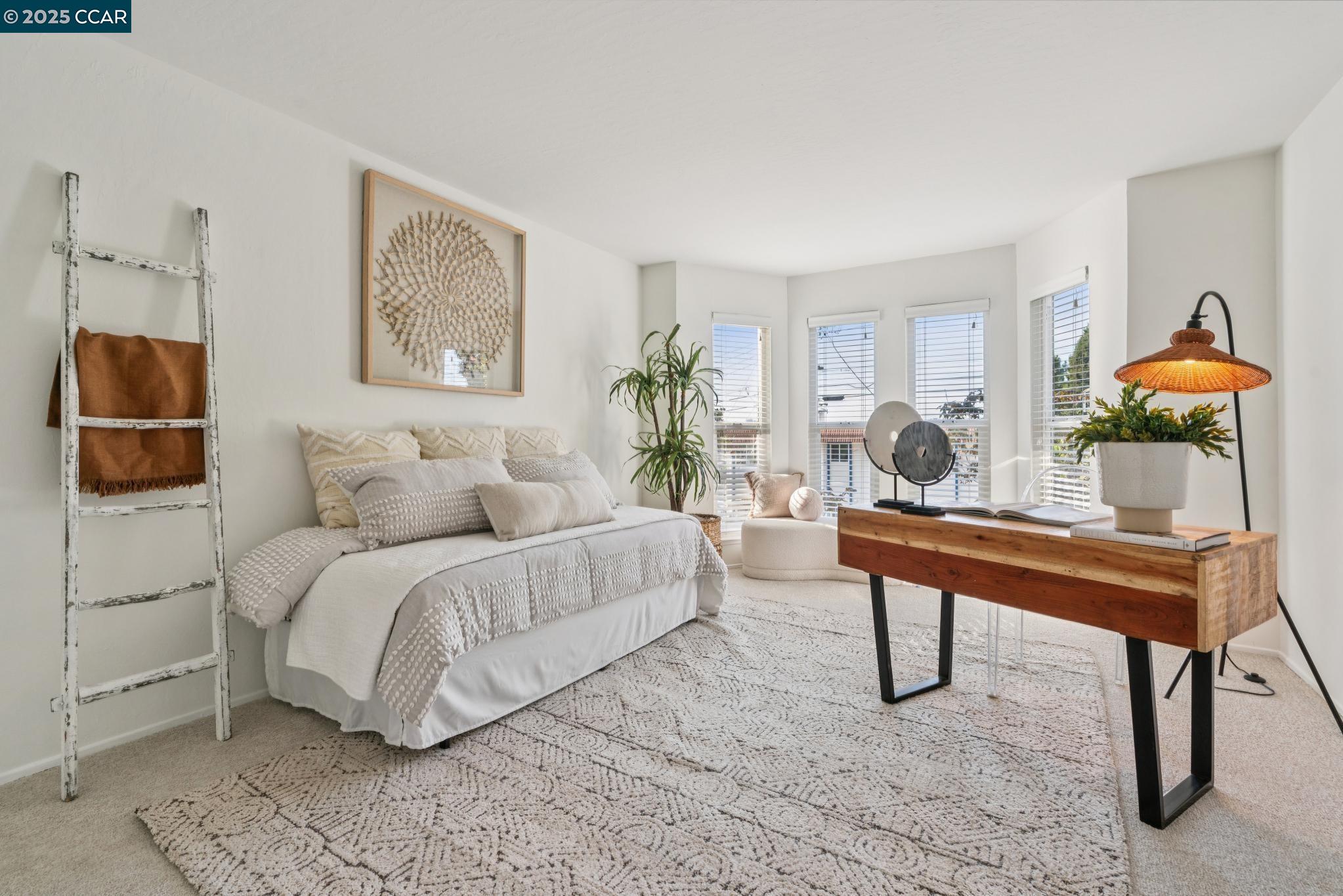 500 Vernon Street, Unit 102 Oakland, CA 94610 - Photo 22 of 43 a bedroom with a bed and a potted plant on dresser