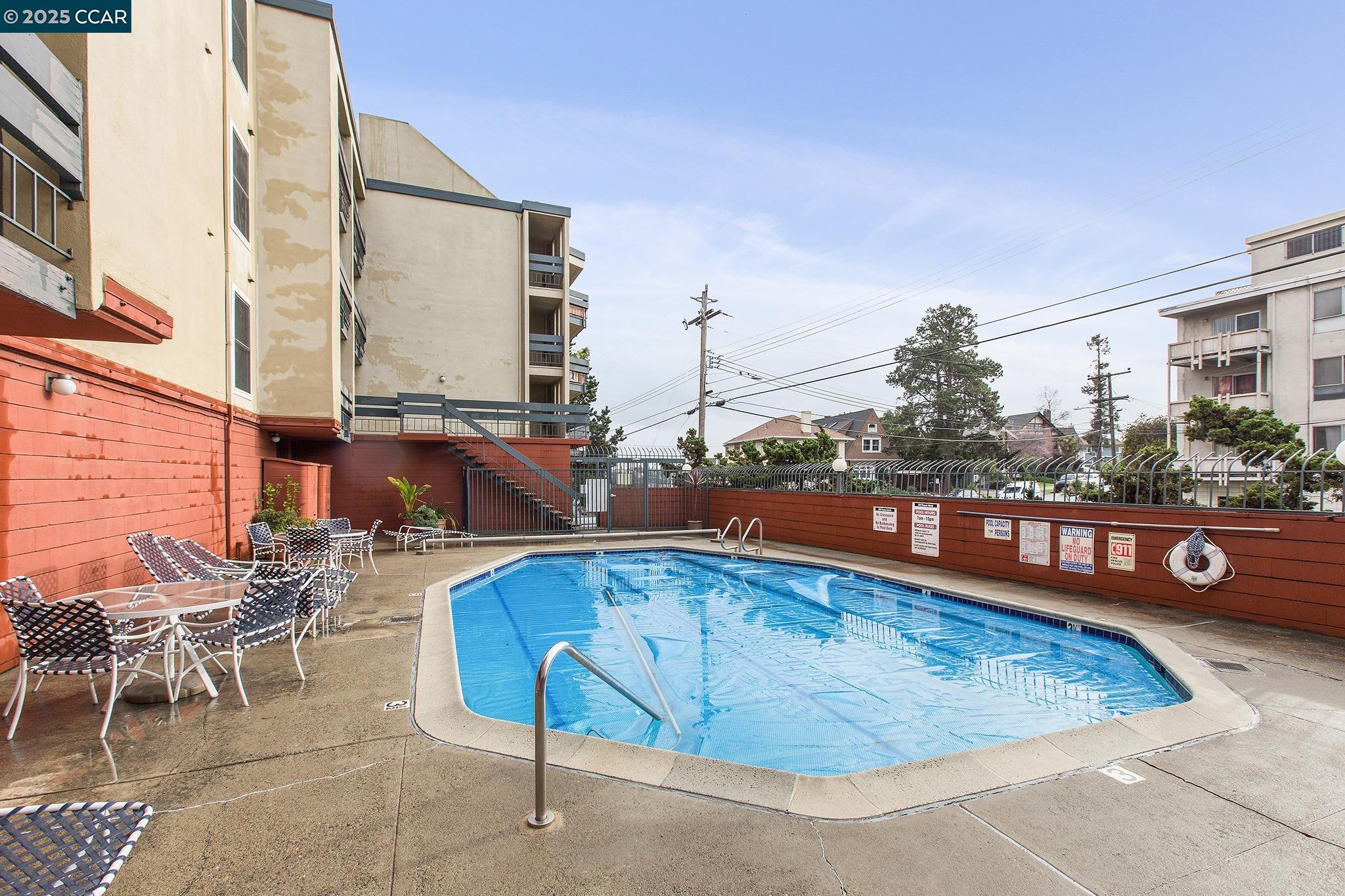 500 Vernon Street, Unit 102 Oakland, CA 94610 - Photo 36 of 43 a view of a swimming pool with chairs