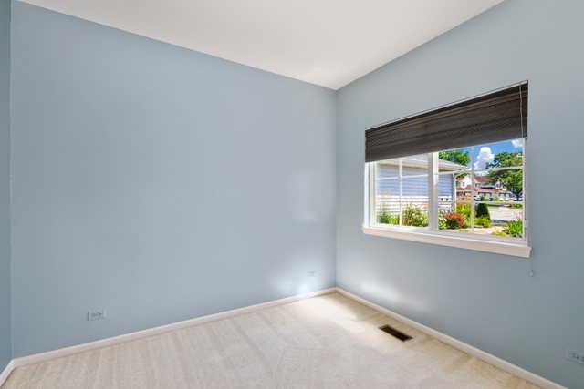 8171 Ripple Ridge Darien, IL 60561 - Photo 17 of 25 an empty room with a window