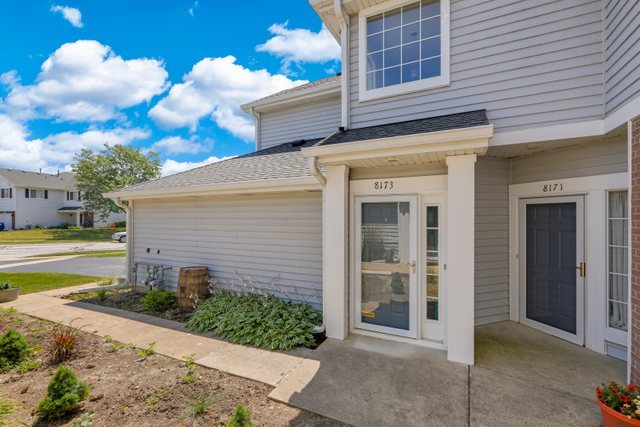 8171 Ripple Ridge Darien, IL 60561 - Photo 4 of 25 a view of a house with a yard